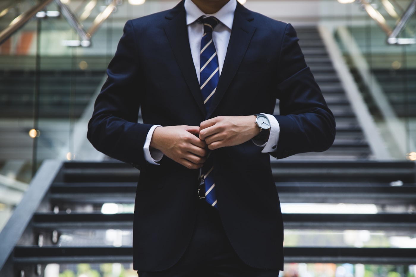Close view of a refined dark suit and tie